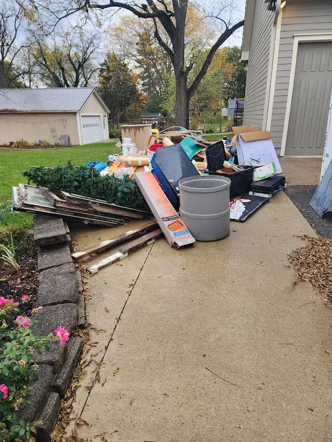 Dumpster being loaded with debris for Commercial Dumpster Rental in Larksville